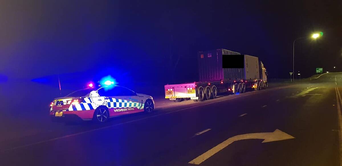 INTERCEPTED: Police were alerted after this truck was seen driving dangerously on the Hume Highway near Holbrook. Serious log book breaches were later identified. 