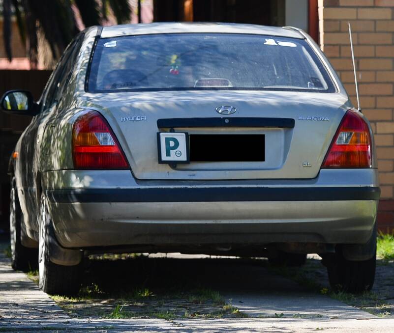SEIZED: A rifle, ammunition and tomahawk were seized from this car in Albury on Saturday. 