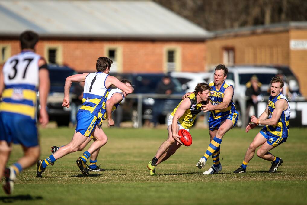 BREAK: Osborne's Elliott Powell breaks a tackle from Goanna veteran Chris Willis at Mangoplah.The home team had all the answers after being challenged in the third quarter. 