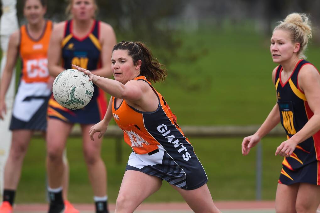 CONTEST: Giants' Amanda McCall and Crows' Grace Finn in action during the weekend's round of Hume League netball. Photo: MARK JESSER