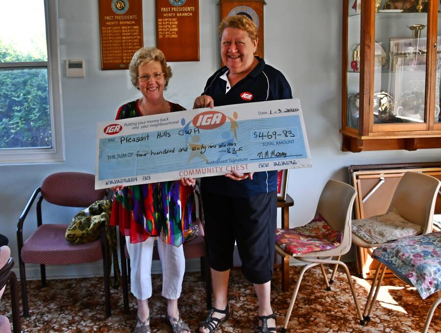 DONATION: Pleasant Hills CWA president Lyn Jacobsen was presented with a cheque for $469.83 from Henty IGA manager Narelle Morey, the money is donated from the IGA Community Chest. 